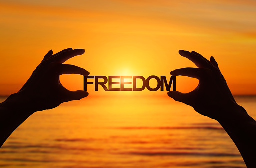freedom-twohands-holding-it